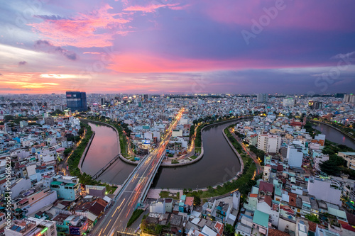 HOCHIMINH CITY, VIETNAM. Aerial sunset view of houses and Business and Administrative Center of Ho Chi Minh (SAIGON) city on NHIEU LOC canal