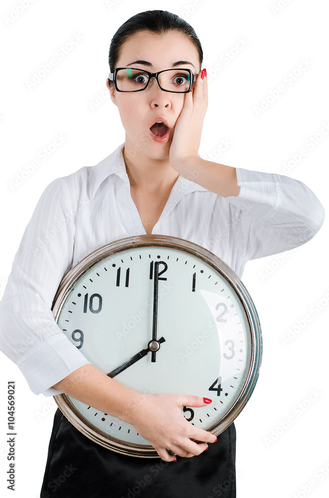 Alarmed, shocked business woman holding a large clock. White isolated background