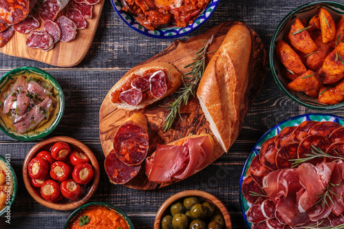 Typical spanish tapas concept, rustic style, top view.