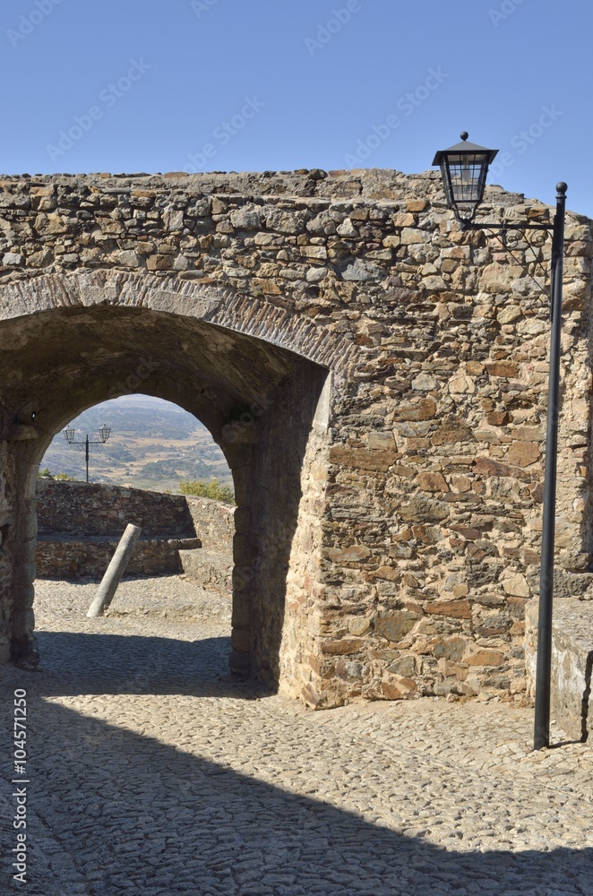 Window in stone arch to the countryside in Marvao, Portugal
