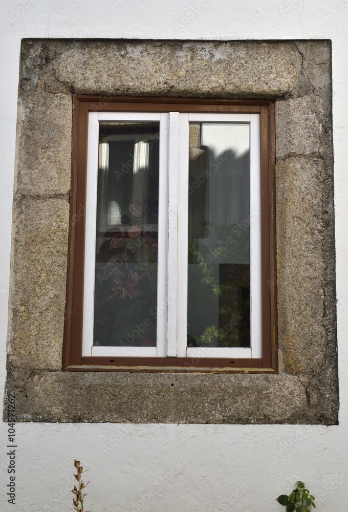 Window on white wall in Marvao, Portugal Window on white wall in Marvao, Portugal