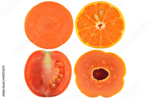 Halves of fruit and vegetable on white background