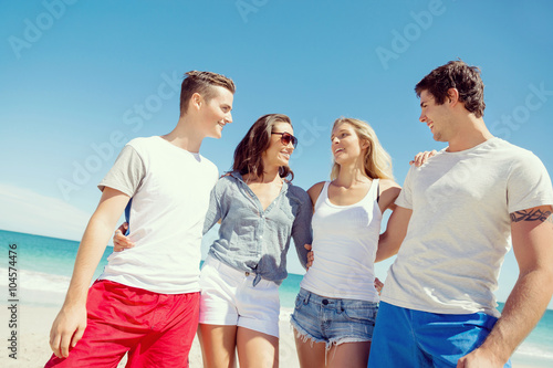 Company of young people on the beach