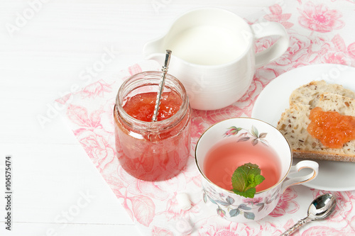 Watermelon Jam, Herbal Tea, Marshmallows. White Wooden Table