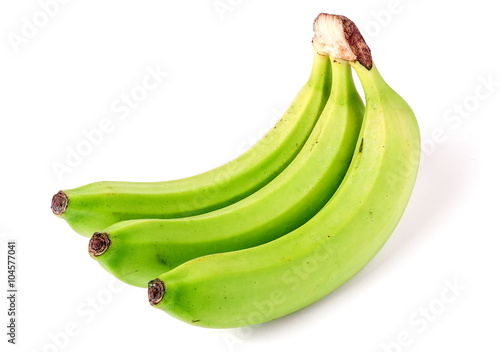 Three green unripe bananas isolated on white background
