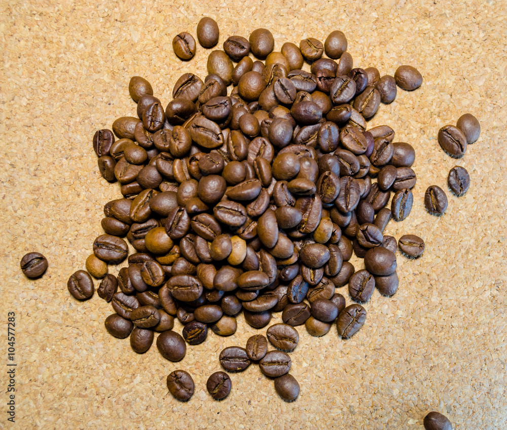 Coffee beans on a cork background Coffee beans on a cork background
