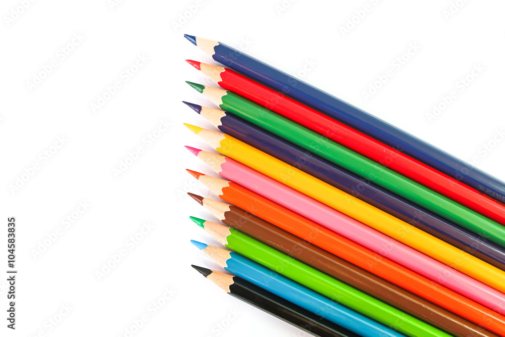 many colorful pencil crayons over a white background many colorful pencil crayons over a white background