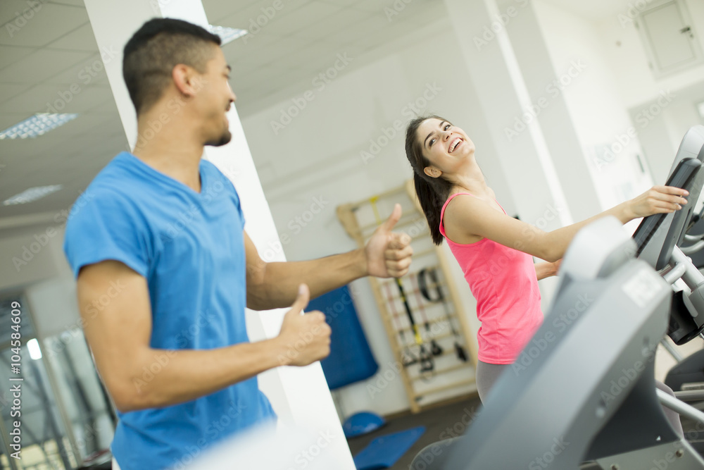Young multiracial people training in the gym Young multiracial people training in the gym