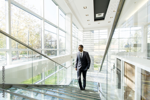 Modern black businessman on the stairs