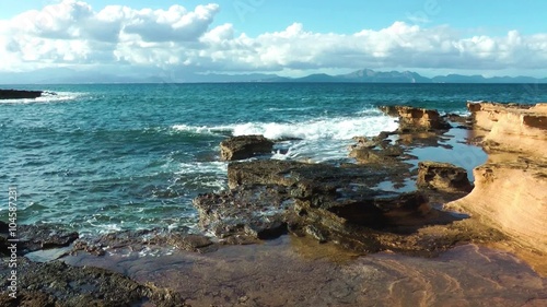 Majorca, sandstone coast and dramatic clouds photo