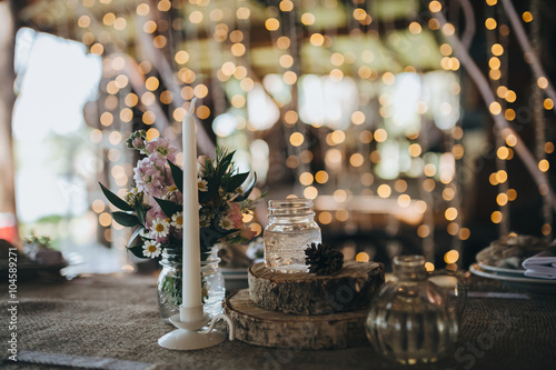 decorations made of wood and wildflowers served on the festive table