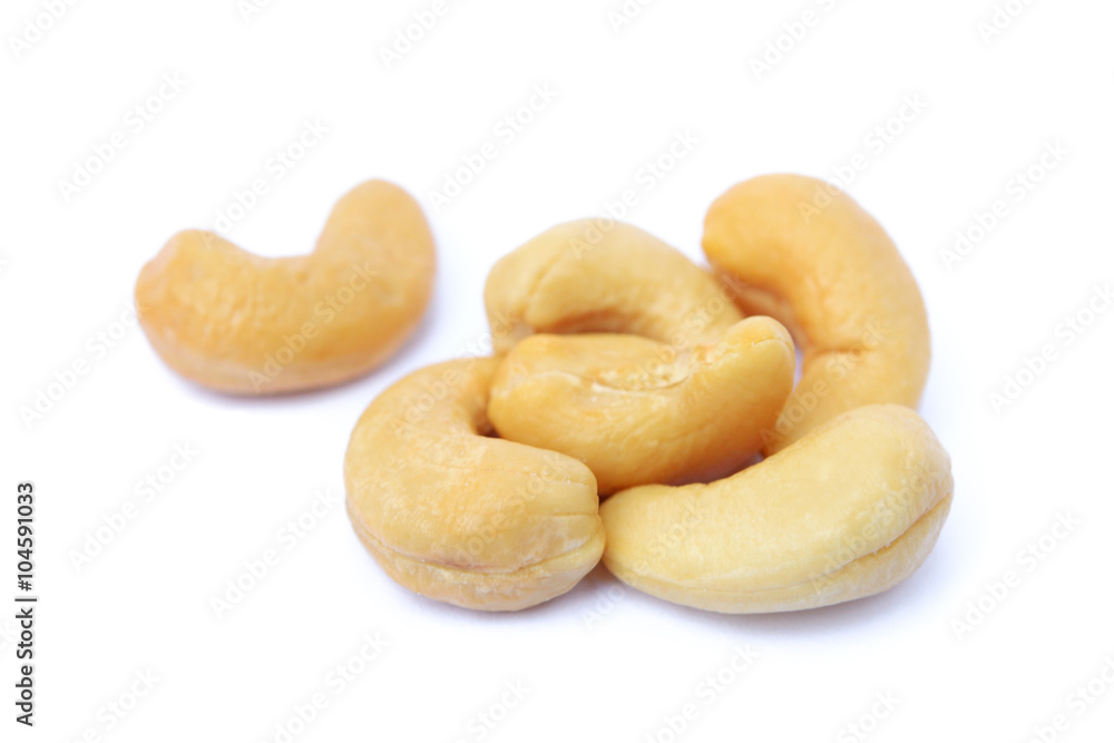Peeled salted cashews isolated on a white background Peeled salted cashews isolated on a white background