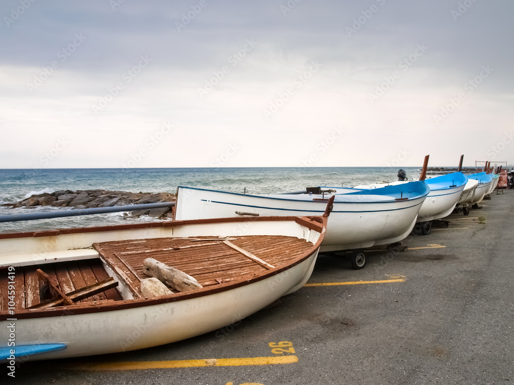 Small fishing boats lying on the shoreline Small fishing boats lying on the shoreline