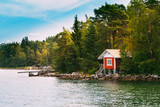 Red Small Finnish Wooden Sauna Log Cabin On Island In Autumn Sea