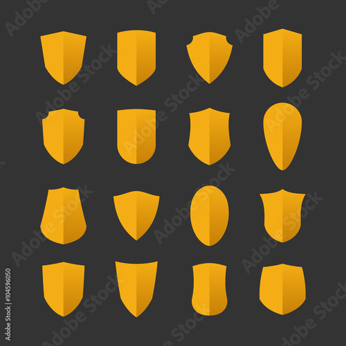 Set of shields in flat design style isolated on a dark backgroun
