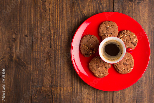 Coffee cup and amaretti biscuits on wooden background. top view