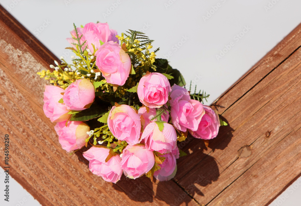 Lovely bouquet on the wooden texture. Roses for the bride. Beautiful flowers. Love story. Nice gift. Lovely bouquet on the wooden texture. Roses for the bride. Beautiful flowers. Love story. Nice gift.