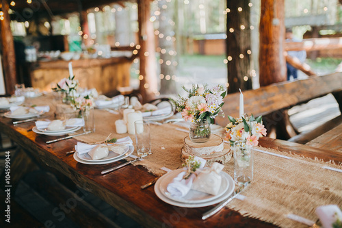 decorations made of wood and wildflowers served on the festive table