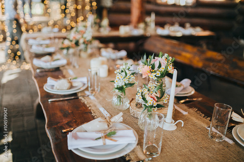 decorations made of wood and wildflowers served on the festive table