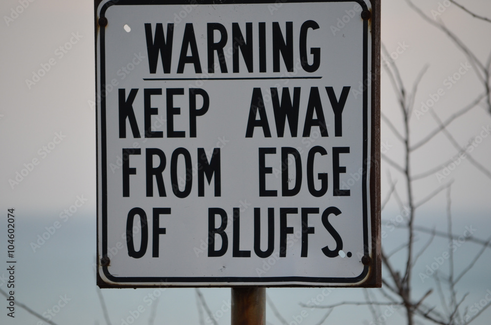 Warning sign for edge of bluffs on Lake Ontario, Toronto, Canada