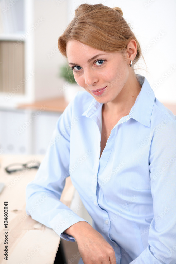 Young blonde business woman with laptop in the office. Business concept. Young blonde business woman with laptop in the office. Business concept.