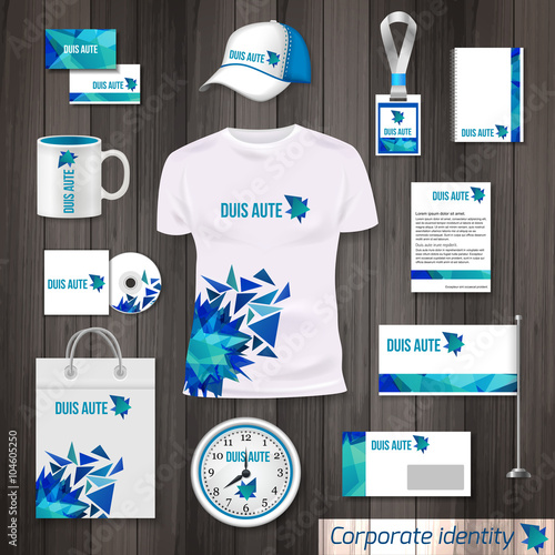 Corporate identity business photorealistic design template. Classic blue stationery template design. Watch, T-shirt, cap, flag, package and Documentation for business isolated on wooden background