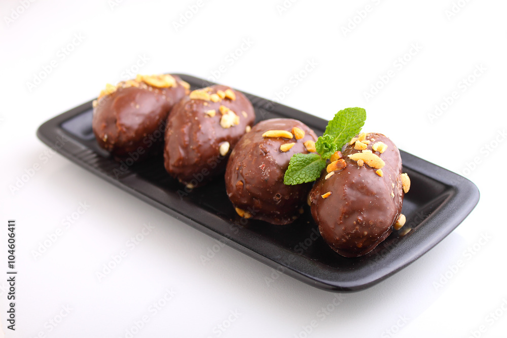 potato cake in a black plate on a white background. Russian kitchen potato cake in a black plate on a white background. Russian kitchen