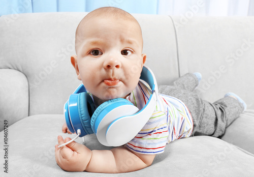 Cute baby with headphones o...