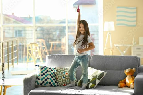 Beautiful little girl singi...