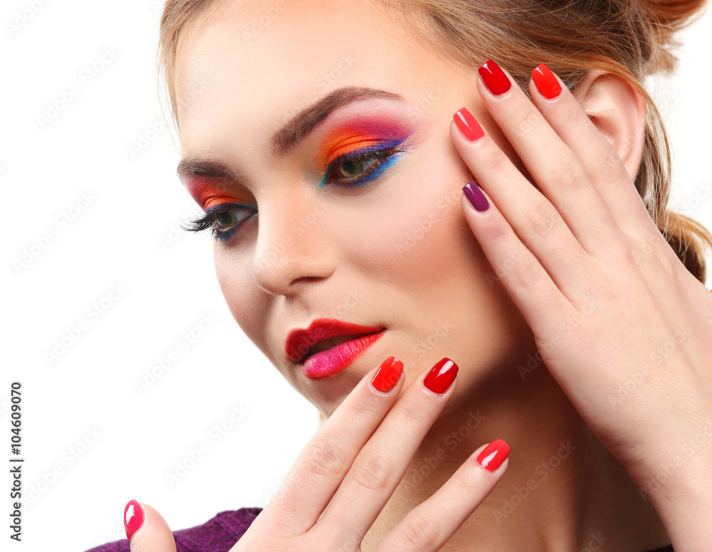 Fototapeta premium Beautiful girl with colorful makeup and manicure, isolated on white