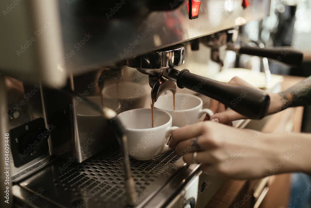 Barista preparing coffee in coffee shop