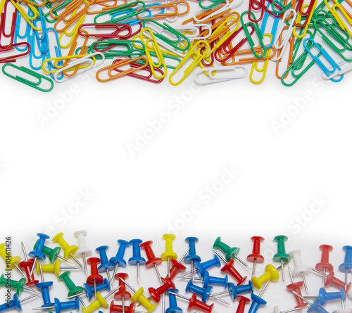 Colorful paper clip and pin isolated on white background