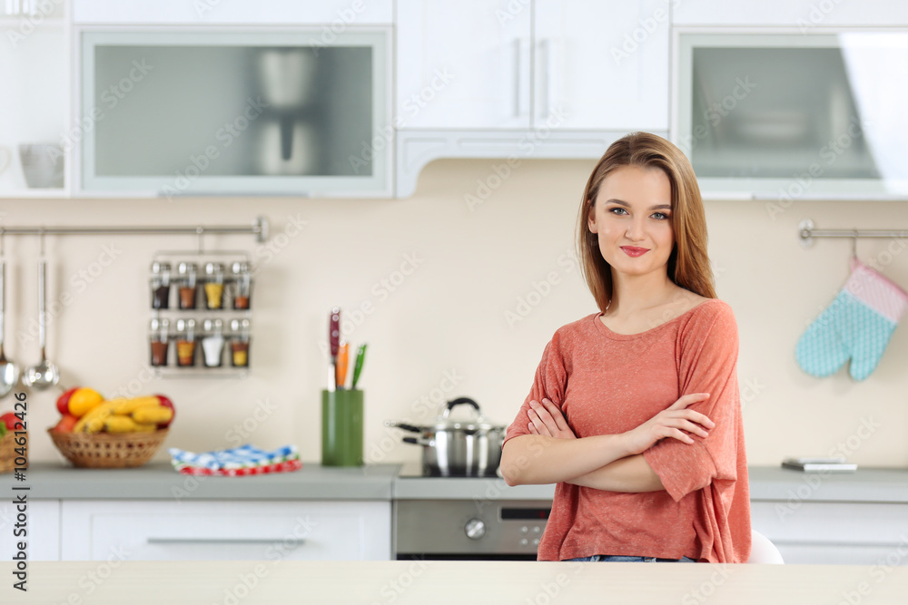 Young woman in the kitchen Young woman in the kitchen