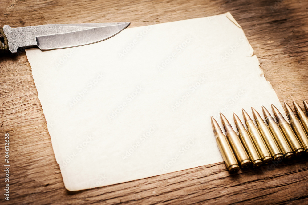 Old paper, knife and bullets Old paper, knife and bullets
