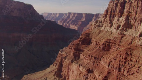 Beautiful aerial over Grand Canyon rim at dawn.
