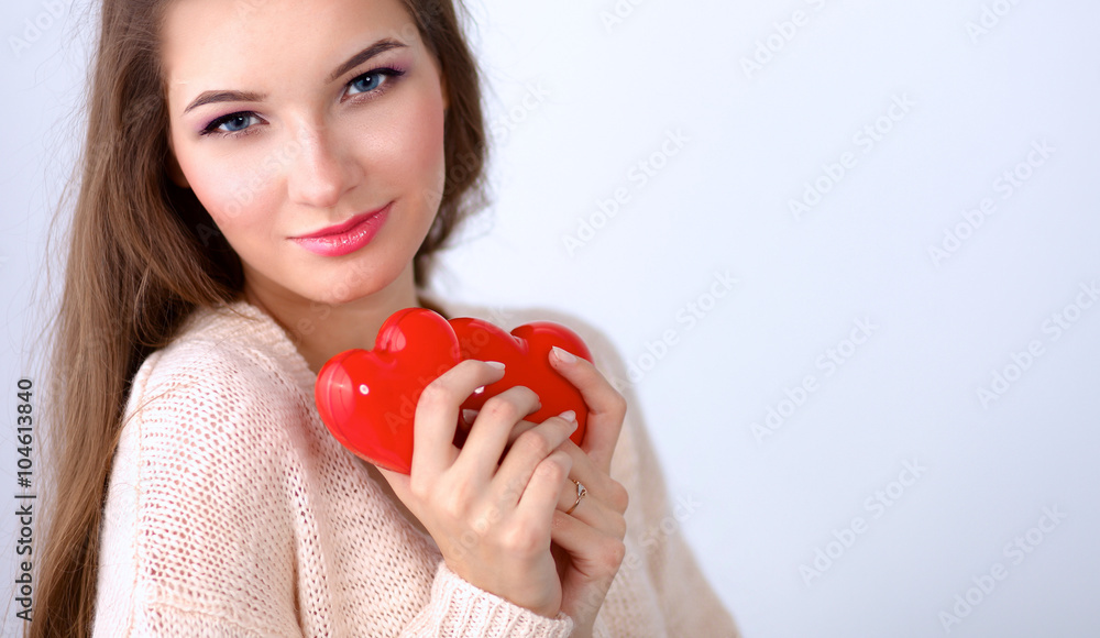 Portrait of beautiful happy woman holding a symbol heart. Portrait of beautiful happy woman holding a symbol heart.