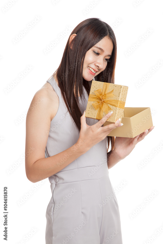 Beautiful young Asian woman with golden gift box Beautiful young Asian woman with golden gift box