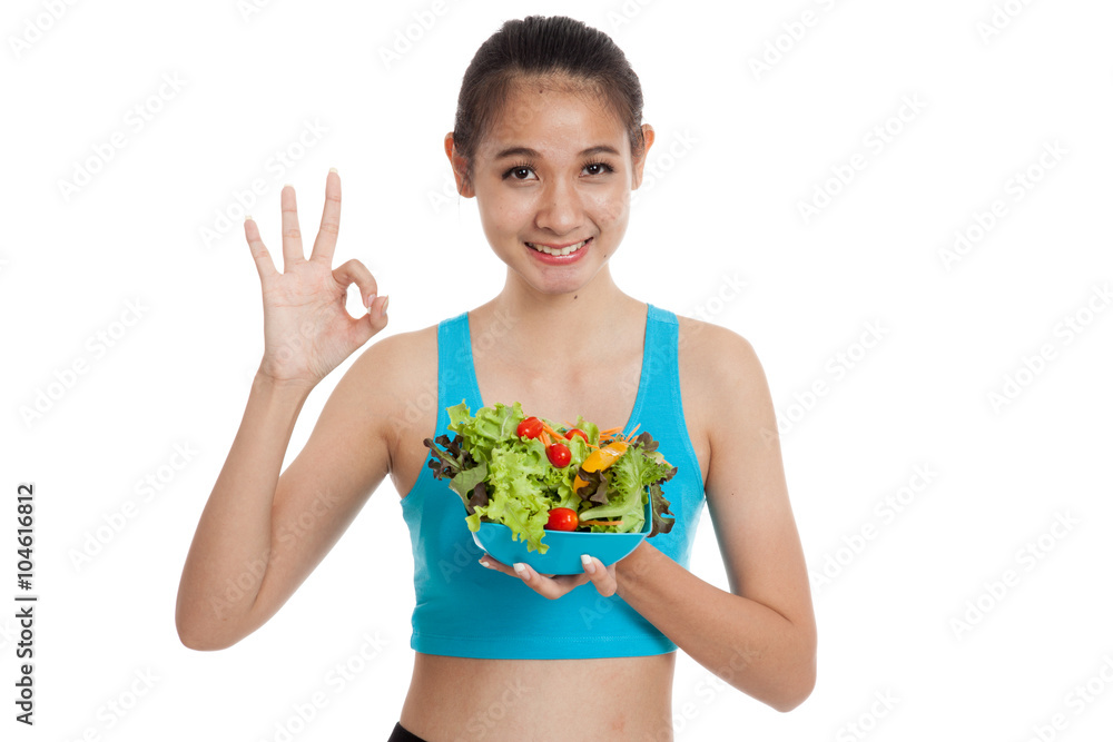 Beautiful Asian healthy girl show OK with salad Beautiful Asian healthy girl show OK with salad