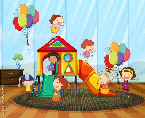 Children playing on the slide in the room