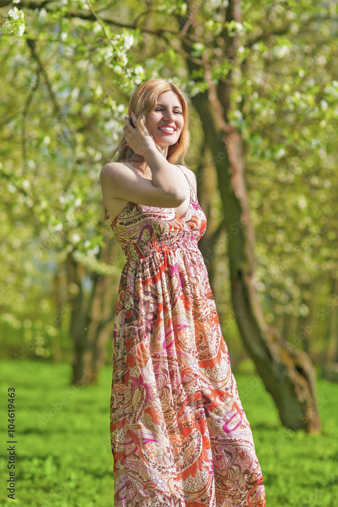 Portrait of Smiling Sensual Blond Woman in Spring Forest Outdoors Portrait of Smiling Sensual Blond Woman in Spring Forest Outdoors