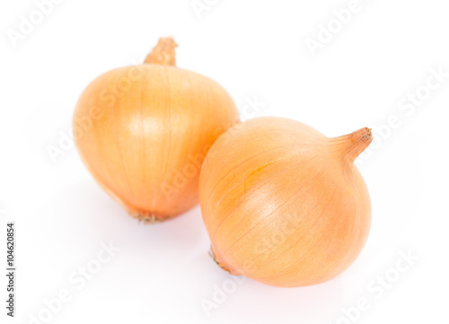 Small gold onion isolated on white background