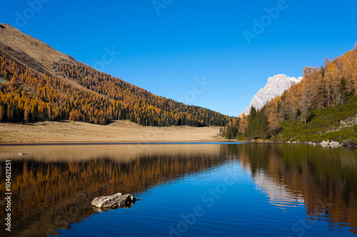 Fototapeta Naklejka Na Ścianę i Meble -  Reflections on water, autumn panorama from mountain lake