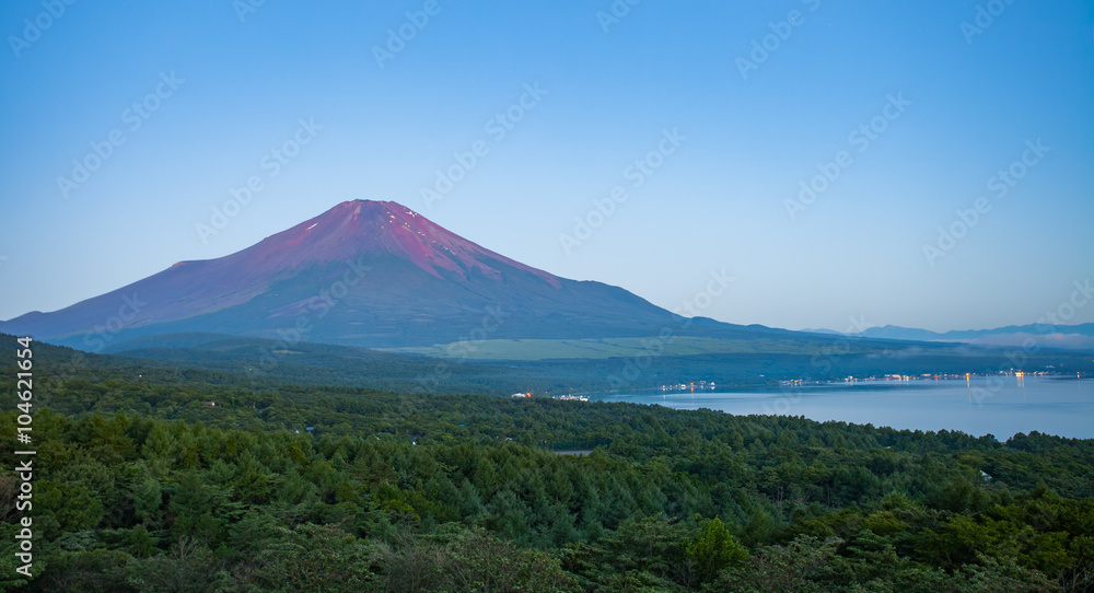 Red color at Top of Mountain Fuji in summer early morning seen from Lake Yamanaka , Yamanashi prefecture