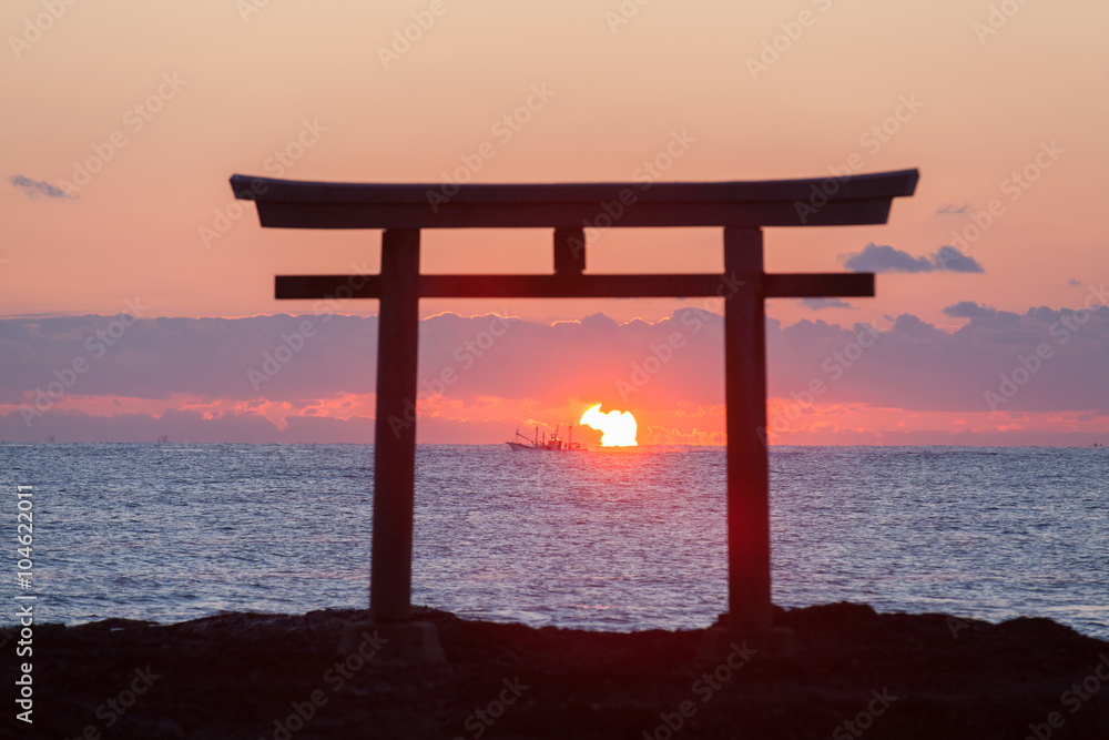 Sunrise and sea at Japanese shinto gate in Oarai city , Ibaraki prefecture