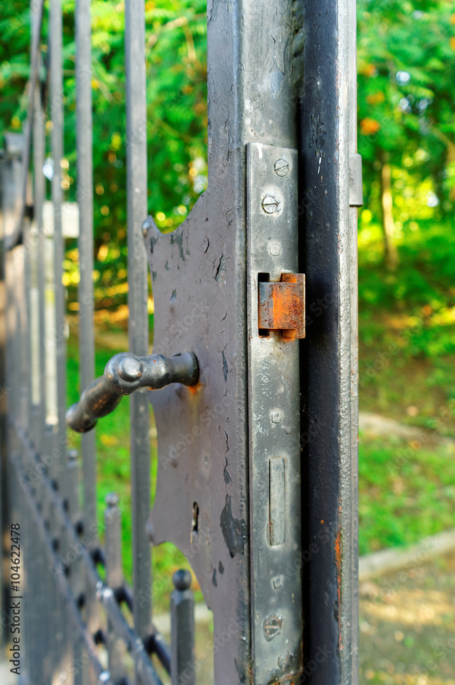 rusty lock in the old iron gate rusty lock in the old iron gate
