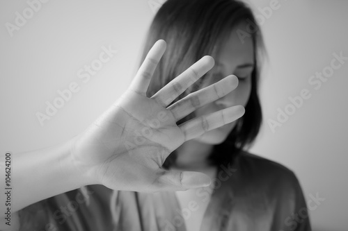 Young woman showing her denial with NO on her hand