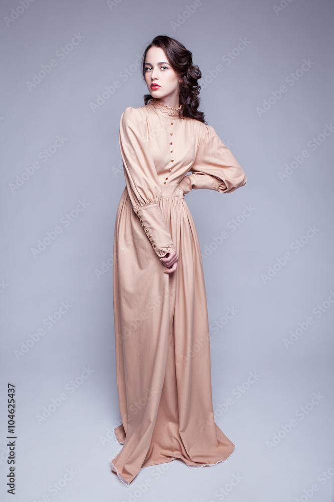 Portrait of young woman in retro dress