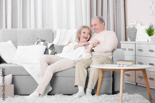 Mature couple laughing toge...