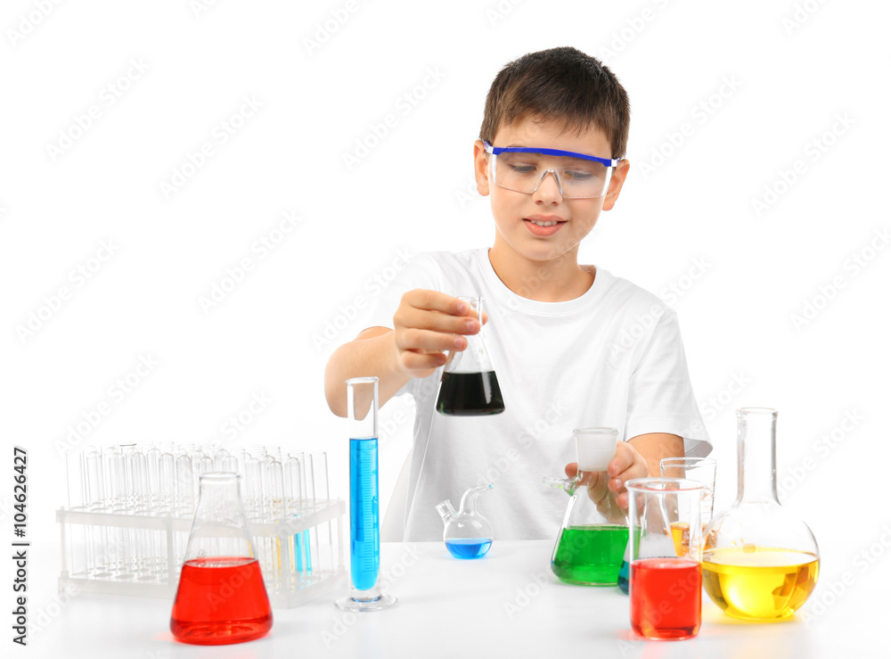 Clever little boy doing a chemical experiments, isolated on white Clever little boy doing a chemical experiments, isolated on white