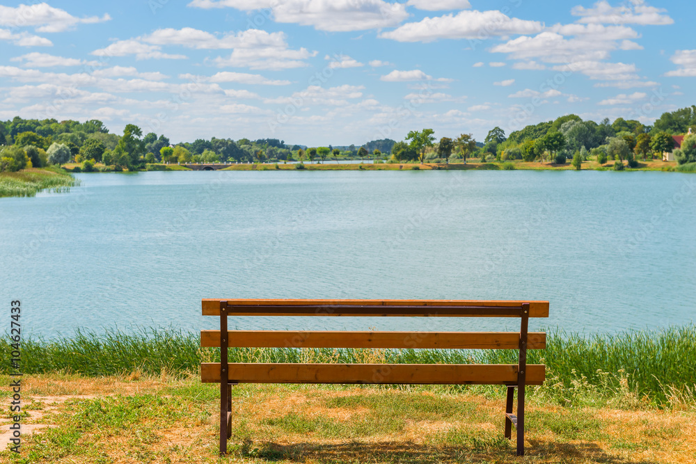 beautiful summer landscape. Empty bench near the lake beautiful summer landscape. Empty bench near the lake